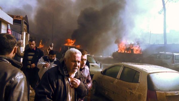 An image grab shows people gathering amidst the debris at the site of a car bomb attack in the rebel-held town of Azaz in northern Syria. (AFP/File)