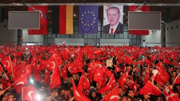 Supporters of Turkish President Recep Tayyip Erdogan wave Turkish flags. (AFP/File)