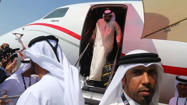 Sheikh Mohammad Bin Rashed Al Maktoum, prime minister of the United Arab Emirates and ruler of Dubai, goes out from a private jet after he toured the Dubai Airshow on Sunday (AFP/File)