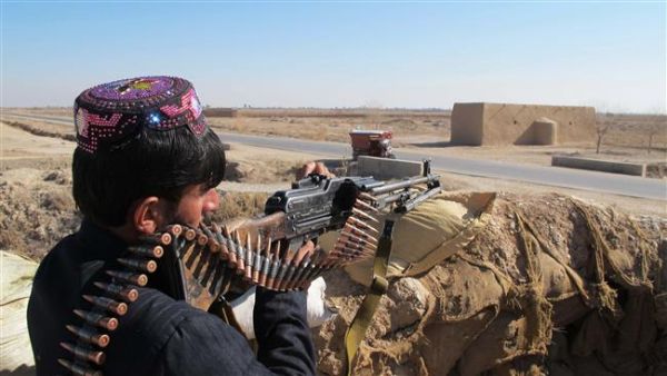 An Afghan Local Police (ALP) personnel keeps watch during an ongoing battle with Taliban militants. (AFP/File)