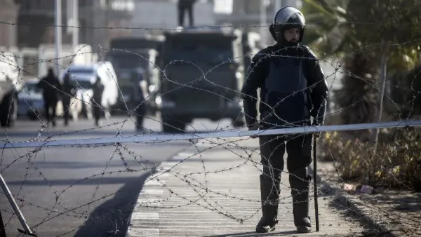 Illustrative photo of Egyptian riot police stand guard in Cairo, January 28, 2014. (AFP/File)