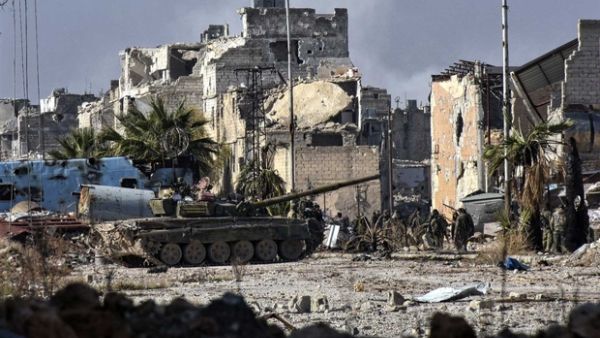 Syrian pro-government forces in the Myessar district in east Aleppo on 4 December 2016. (AFP/File)