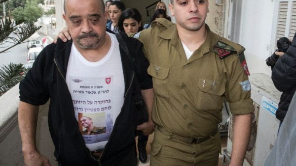 Azaria's father, Charlie, reportedly sat down with Col. Guy Hazut, the commander of the Kfir Brigade, in which his son serves. (AFP/File)