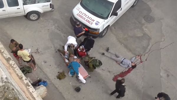 Footage released by Israeli NGO B'Tselem shows the body of Palestinian Ramzi al-Qasrawi, who was killed by Israeli forces in Hebron on March 24, 2016. (B'Tselem)