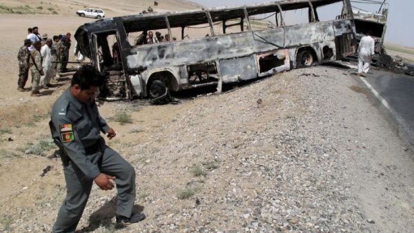 In April 2013 a bus hit a wrecked fuel tanker in the southern province of Kandahar. (AFP/File) In April 2013 a bus hit a wrecked fuel tanker in the southern province of Kandahar. (AFP/File)