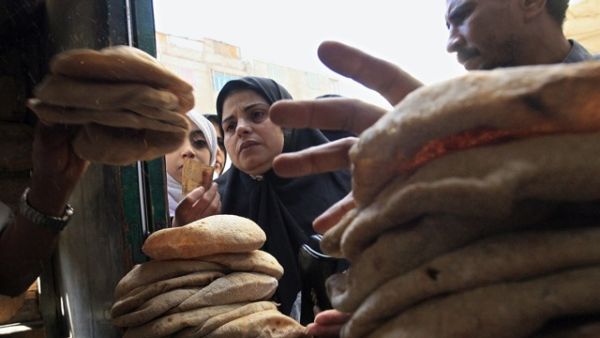 A woman stands in line for subsidised bread. (AFP/File) A woman stands in line for subsidised bread. (AFP/File)