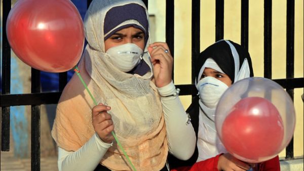 Two Egyptian girls wear masks to protect against swine flu. (AFP/File)