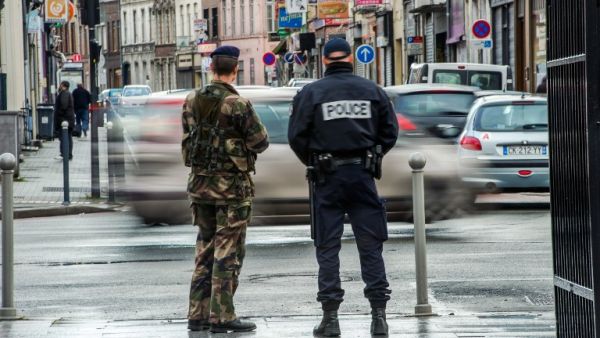 Illustrative photo of a French police officer and a soldier on patrol. (AFP/File)