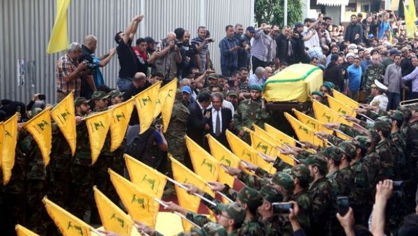 The coffin is carried through the Hezbollah controlled Dahiyeh district of Beirut. (AFP/File)