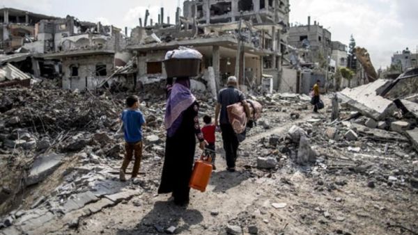 A displaced Palestinian family returns home amid the destruction in part of the northern Beit Hanun district of Gaza Strip. (AFP/File) A displaced Palestinian family returns home amid the destruction in part of the northern Beit Hanun district of Gaza Strip. (AFP/File)