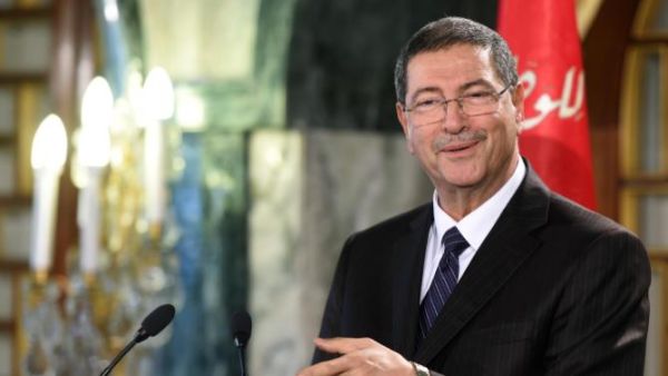 Tunisia's Prime Minister Habib Essid announces a new cabinet ministers list after presenting the list to the Tunisia's President Beji Caid Essebsi during a press conference at Carthage Palace in Tunis on January 23, 2015. (AFP/Fethi Belaid)