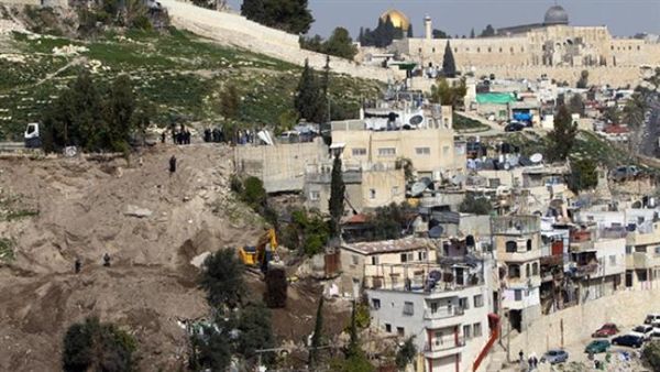 In this file photo, an Israeli army bulldozer destroys Palestinian houses in the East Jerusalem area of Silwan. (AFP/File)