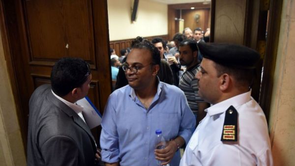 Renowned human rights activist Hossam Bahgat (C), seen here leaving a courtroom. (AFP/File)