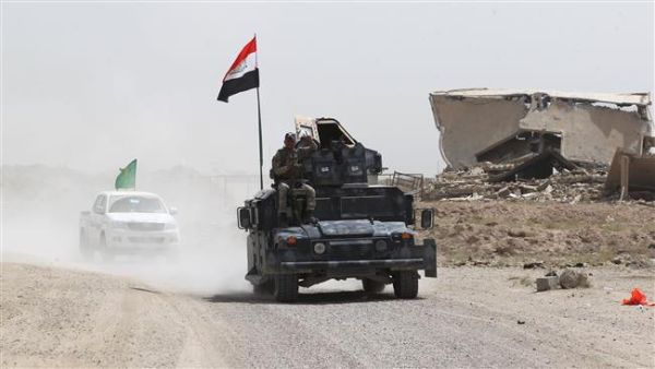 Iraqi government forces drive on a road near the village of al-Azraqiyah, northwest of Fallujah, during an operation to regain control of the area from Daesh, June 5, 2016. (AFP/File) Iraqi government forces drive on a road near the village of al-Azraqiyah, northwest of Fallujah, during an operation to regain control of the area from Daesh, June 5, 2016. (AFP/File)