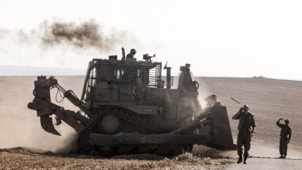 An Israeli D9 bulldozer rolls along the southern Israeli border with the Gaza Strip. (AFP/File)