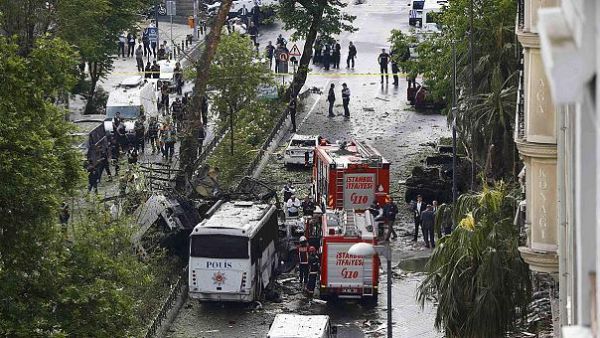 Fire engines are seen beside a Turkish police bus that was targeted in a bomb attack in a central Istanbul district, Turkey, June 7, 2016. (Twitter)