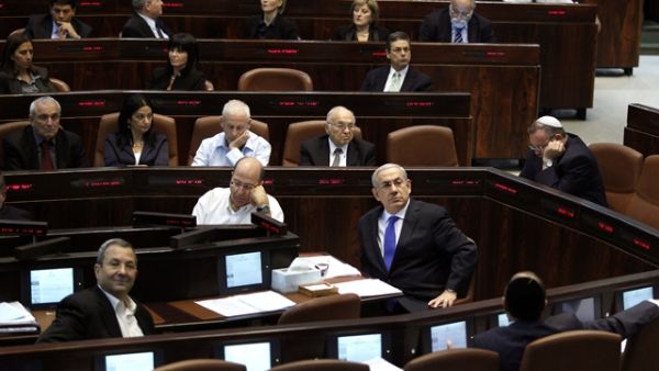 Israeli Prime Minister Benjamin Netanyahu (center-right) and Defense Minister Ehud Barak (left) during the session of the Knesset in Jerusalem. (AFP/File)
