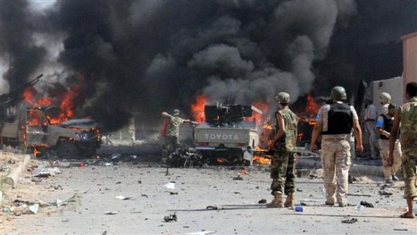 Fighters from the pro-government forces loyal to Libya's Government of National Accord (GNA) look at some of their vehicles burning after a Daesh bomber detonated his explosives close to a group of soldiers in an area of central Sirte on August 16, 2016. (AFP/File)