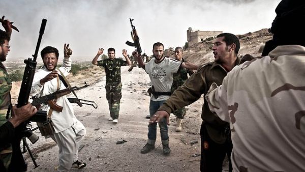 Libyan rebels round-up soldiers loyal to Muammar Gaddafi following their capture after clashes in Libya's western mountain region of Qalaa. (AFP/File)