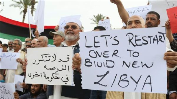 Pro-UN-backed government protesters hold placards and shout slogans during a demonstration in Libya. (AFP/File)