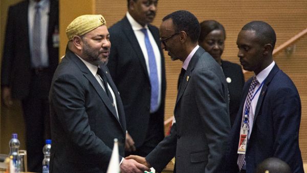 King Mohammed VI of Morocco (left) greets Rwanda's President Paul Kagame. (AFP/File)