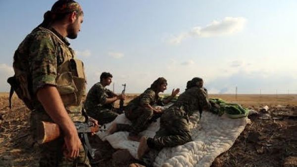 Members of the Syrian Democratic Forces (SDF) at an outpost near Manbij in the north of Syria. (AFP/File)