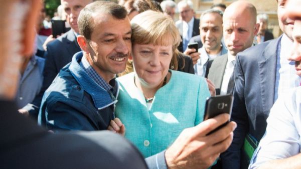 Asylum seeker takes a selfie picture with German Chancellor Angela Merkel. (AFP/File)