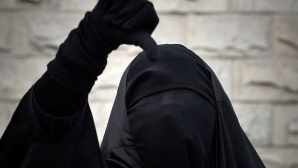 A Bahraini Shia Muslim woman wearing the niqab shouts anti-government slogans during a demonstration. (AFP/Mohammed Al Sheikh)