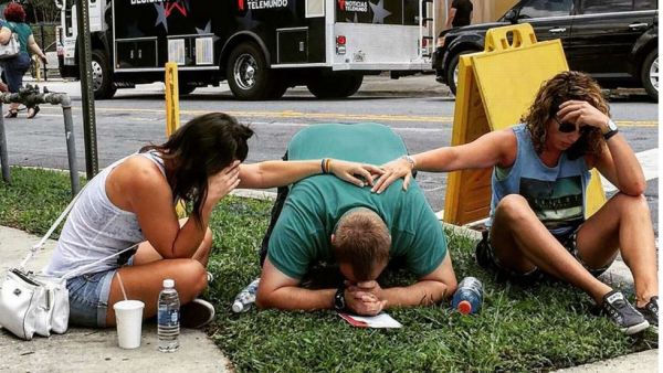 People mourn their lost loved ones outside the Pulse nightclub where the attack took place. (AFP/File) People mourn their lost loved ones outside the Pulse nightclub where the attack took place. (AFP/File)