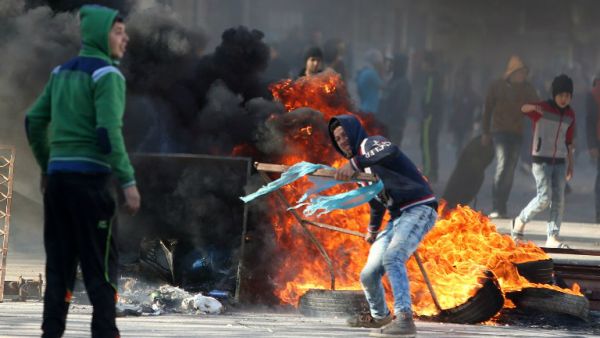 Palestinian youths clash with Israeli security forces in Qabatiya, a town near Jenin. (AFP/File)
