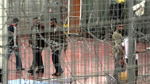 Palestinian prisoners walk 06 November 2005 at the yard of Megiddo prison. (AFP/File)