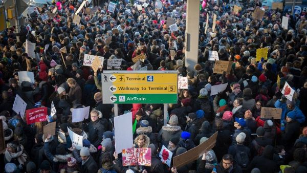 Demonstrators at JFK International Airport protest President Donald Trump's executive order suspending refugee arrivals and imposing tough controls on some travellers. (AFP/Bryan R. Smith)