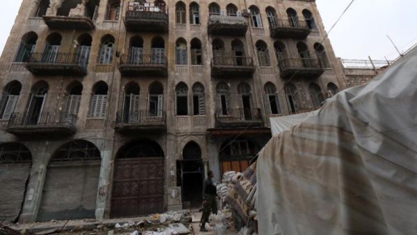 A rebel fighter monitors a street in the old city of Aleppo, Syria. (AFP/File)