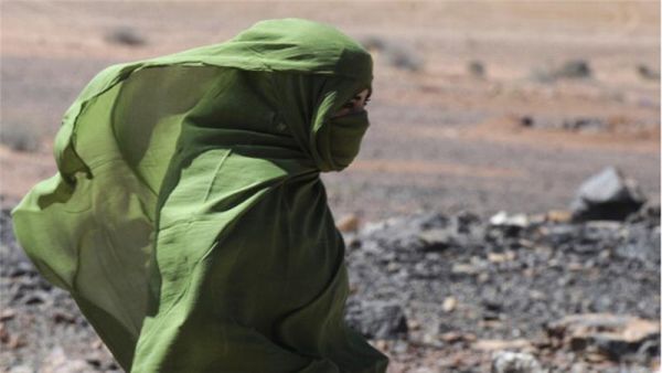 A Sahrawi woman walks in the desert near the Western Sahara village of Tifariti. (AFP/File)