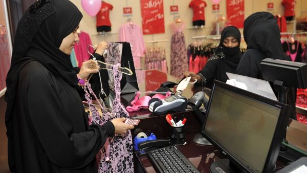 Fully-veiled Saudi women shop at a lingerie store in the Saudi Red Sea port of Jeddah on 2 January 2012. (AFP/File)