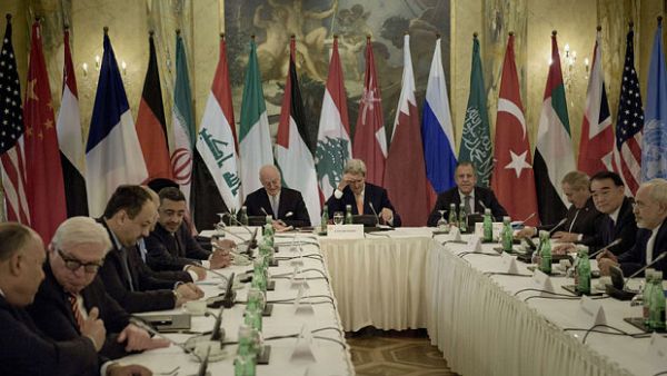 John Kerry, the US secretary of state, meets ministers from countries that are both for and against Syria's regime in Vienna. (AFP/Brendan Smialowski)
