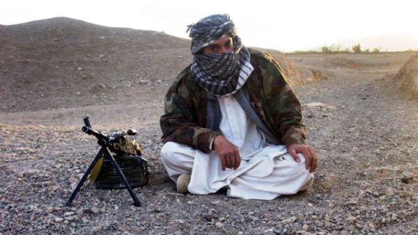 In this file photo taken on September 26, 2008, a fighter with Afghanistan's Taliban militia poses with a machine-gun in Wardak province. (AFP/File)