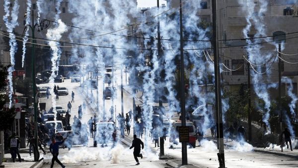 Israeli borderpolice shoot tear gas at Palestinians in the West Bank city of Bethlehem on December 18, 2015. (Twitter)