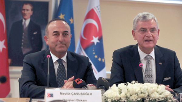 Turkish Foreign Minister Mevlut Cavusoglu (L) and Turkish EU Affairs Minister Volkan Bozkir (R) hold a press conference. (AFP/File)