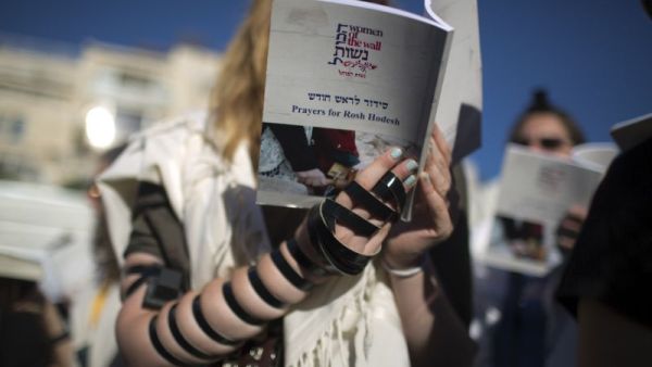 Members of the liberal Jewish religious group Women of the Wall, wearing traditional Jewish prayer garb. (AFP/File)