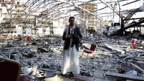 A Yemeni man stands on October 24, 2016 at the site of a Saudi airstrike on a funeral ceremony that killed 140 people and wounded 525 others earlier this month. (AFP/File)