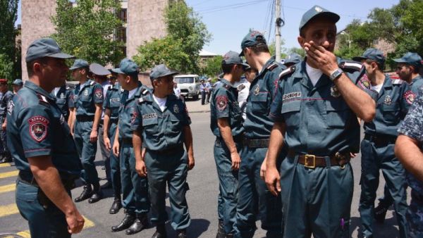 Armenian police officers block the streets to Erebuni police station in Yerevan on July 17. (AFP/File)