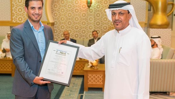Obaid Al Salami receiving the ISO certification on behalf of Dubai Investments Real Estate Company.