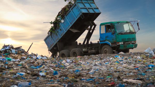 Dump truck unloading waste on a landfill. (Shutterstock/ File Photo)
