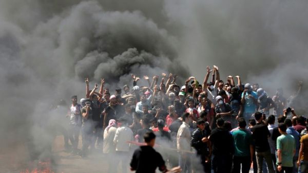 Palestinians burn tyres near the Strip border on May 14, 2018. (AFP/File Photo)