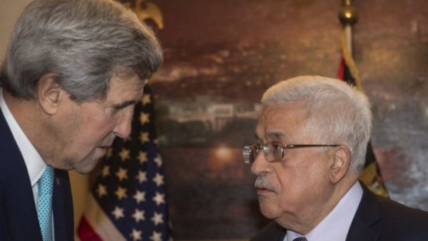 US Secretary of State John Kerry met with PA President Mahmoud Abbas in Amman on Sunday. (AFP / Nicholas Kamm)