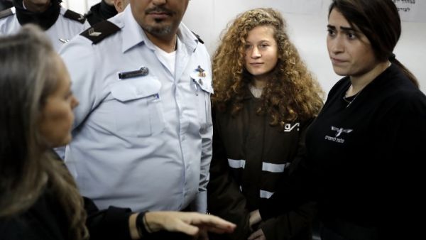 Sixteen-year-old Palestinian Ahed Tamimi stands for a hearing in the Israeli military court on January 15, 2018 (Thomas Coex/AFP)