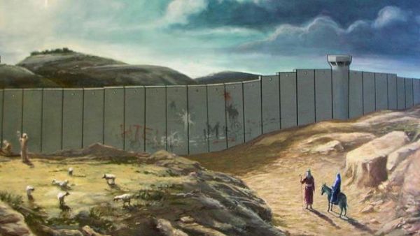 Banksy's Christmas card from 2015 shows Joseph and Mary barred from entry to Bethlehem by the current separation wall. [artwork by www.banksy.co.uk/]