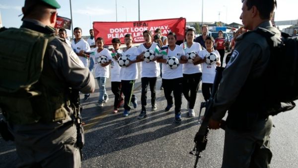 Palestinians are prevented by security forces from playing football in the Israeli settlement of Maale Adumim, October 2016 (AFP)