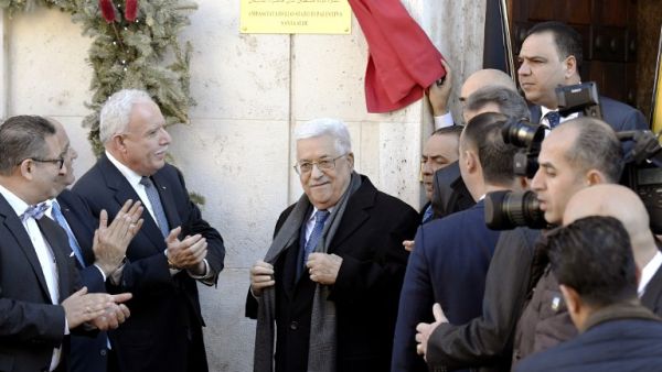 Palestinian president Mahmoud Abbas looks on after he inaugurated the new Palestinian diplomatic mission to the Holy See with Palestinian Ambassador Issa Kassissieh (L) in Rome on January 14, 2017. (AFP/Tiziana Fabi)